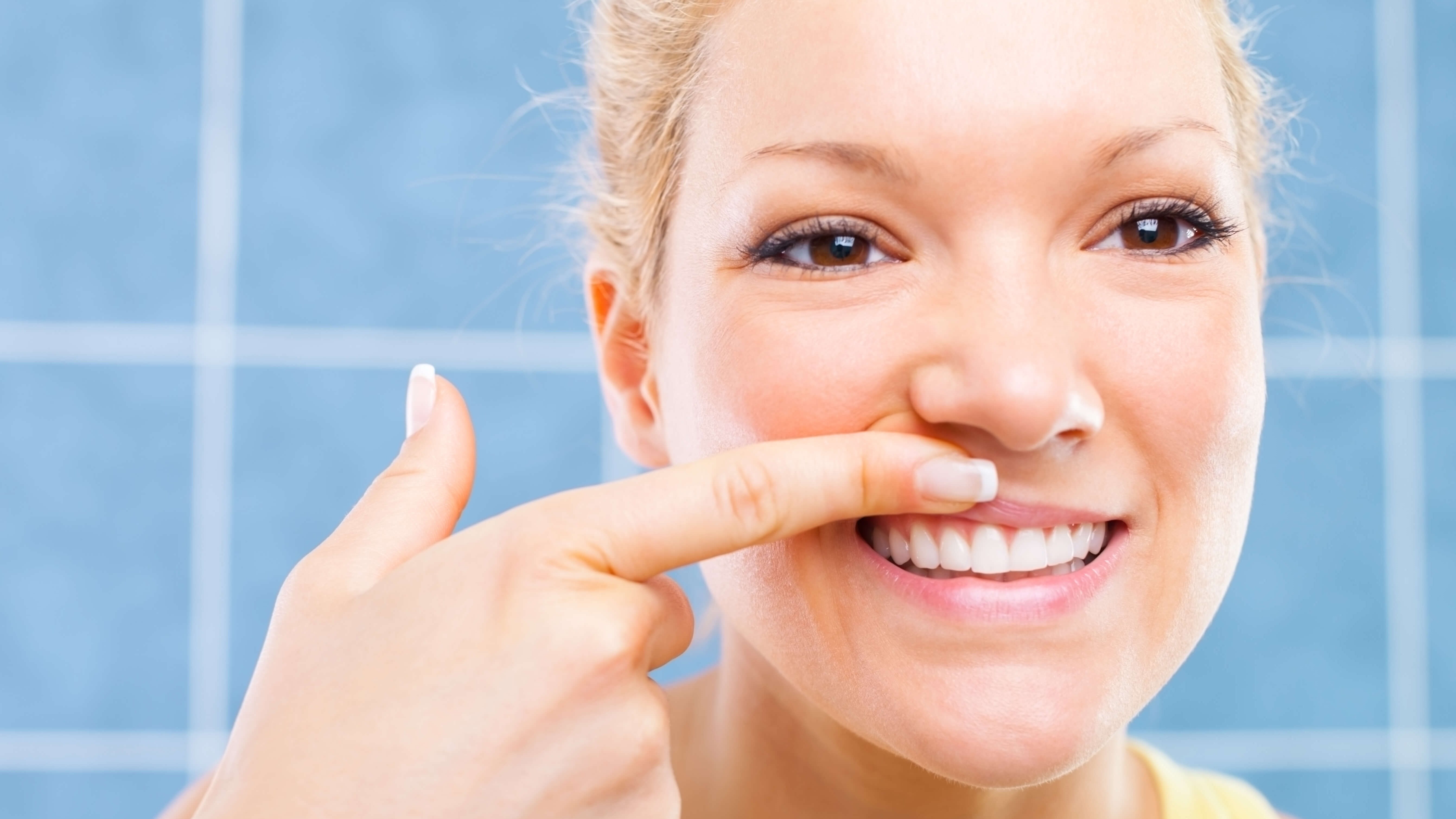 woman looking at teeth